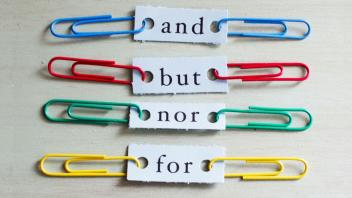 colorful paper clips used to show sentence combining words