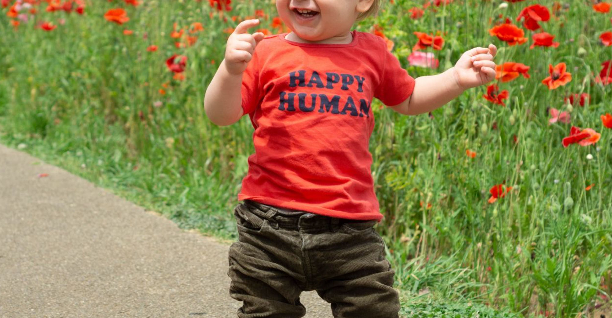 Toddler wearing tee-shirt that says "Happy Human"