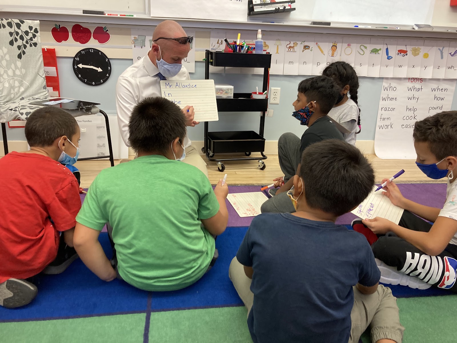 male elementary teacher demonstrating reading lesson