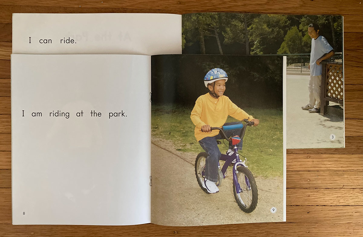 Page from predictable book showing a child bike riding