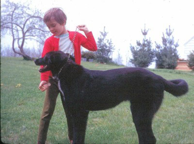 Children's author Sally J. Pla as a child with her dog Lucky