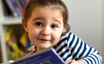 preschooler with picture book
