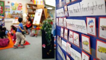 word wall in first grade classroom filled with vocabulary words