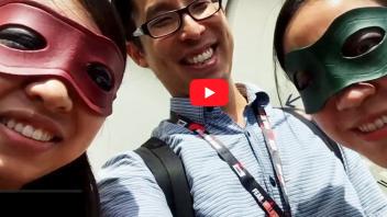 Gene Yang with two dressed up visitors at Comicon