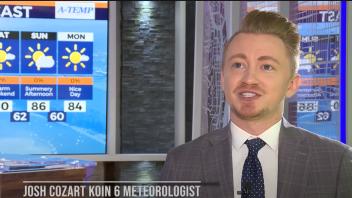Video still of television meteorologist in front of the weather board