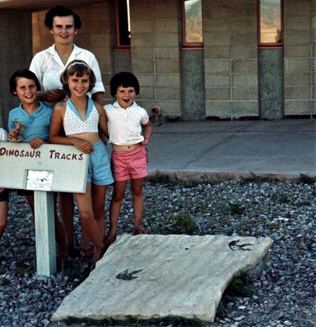 Children's nonfiction author Jane Kurtz as a young child with her mother and two siblings looking at dinosaur track
